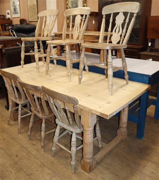 A Victorian style rectangular pine kitchen table and six Victorian elm and beech Windsor kitchen chairs L.198cm